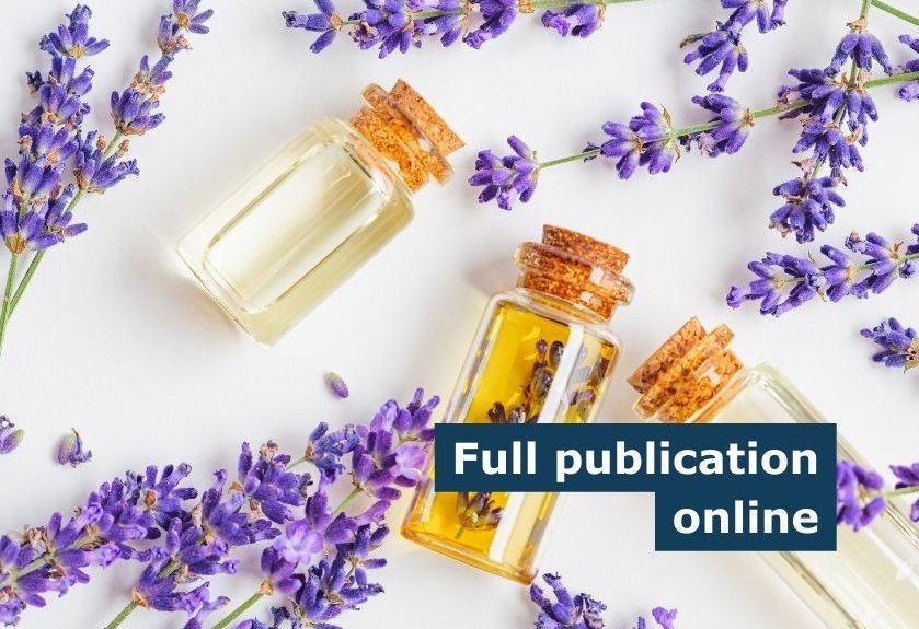 A minimalistic picture of lavender oils on a white background