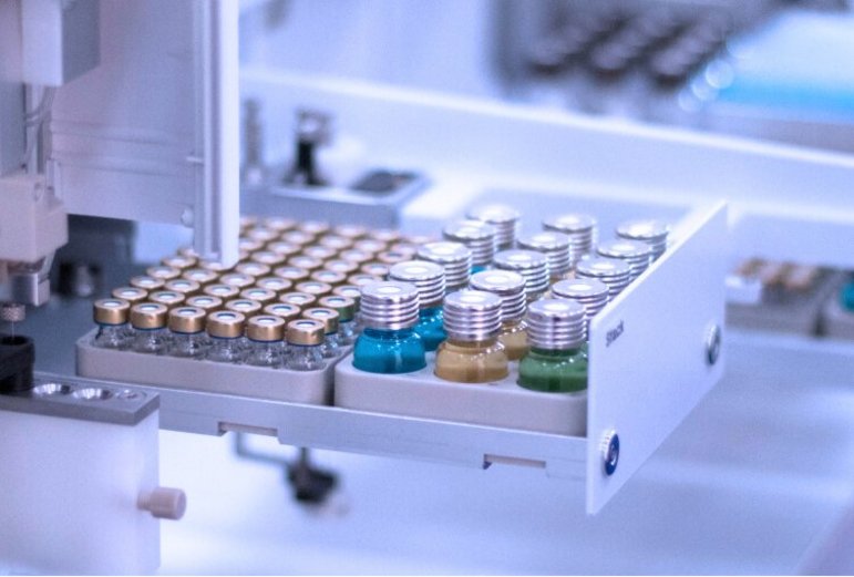 PAL System robotic arm handling of vials with colored liquids in a stack  for sample automation.
