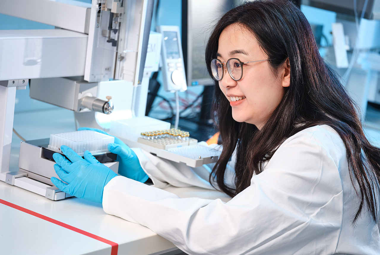 PAL System an Automated Sample Preparation Robot  Showing a scientist in front of an automated sample preparation robot